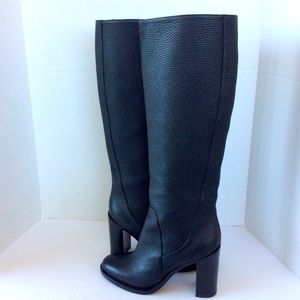Tall black leather knee high boots